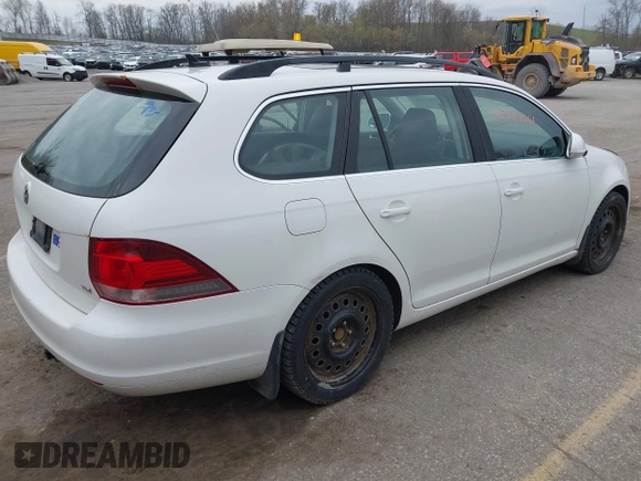 2014 Volkswagen Jetta SportWagen TDI with VIN 3VWML7AJ5EM601267, listed as a IAAI auction lot 42074261 with 155,310 mi miles. Bid and sale history available at carsss.com. Image 4.