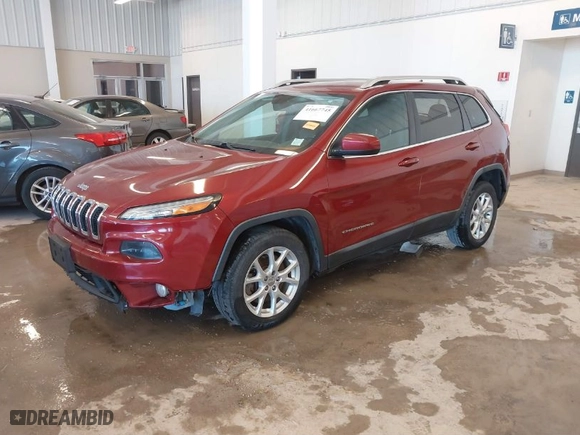 2014 Jeep Cherokee Latitude with VIN 1C4PJLCSXEW154505, listed as a IAAI auction lot 41667745 with 199,957 mi miles. Bid and sale history available at carsss.com. Image 2.