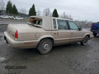 1992 Chrysler New Yorker z VIN 1C3XV66R9ND794543, wystawiony jako Copart lot #45347925 z przebiegiem 46 550 mil mil oraz Tytuł czysty. Historia ofert i sprzedaży dostępna na DreamBid. Obrazek 3.