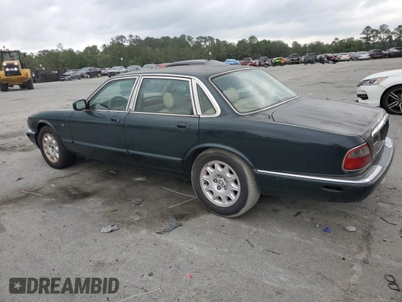1999 Jaguar XJ with VIN SAJHX1044XC865054, listed as a Copart auction lot 57825325 with 71,145 mi miles and Clean title. Bid and sale history available at DreamBid. Image 2.