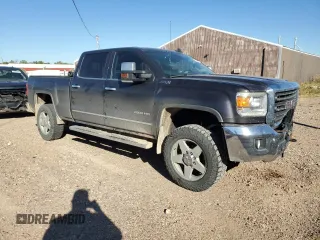 2015 GMC Sierra 2500HD SLT with VIN 1GT12ZEG8FF552439, listed as a Copart auction lot 72850724 with 147,888 mi miles and Salvage title. Bid and sale history available at DreamBid. Image 4.