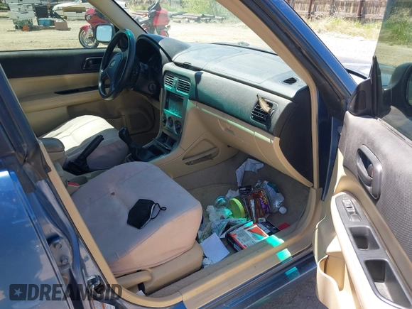 2007 Subaru Forester X with VIN JF1SG63627G718079, listed as a IAAI auction lot 42290134 with 303,089 mi miles and . Bid and sale history available at DreamBid. Image 5.