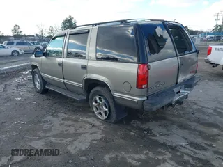 1999 GMC Yukon with VIN 1GKEK13R8XJ804104, listed as a IAAI auction lot 41359701 with 296,522 mi miles. Bid and sale history available at carsss.com. Image 3.