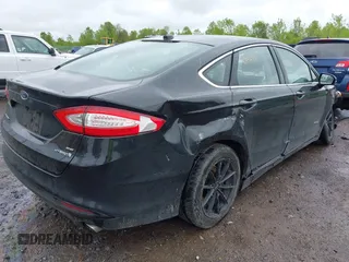 2014 Ford Fusion SE Hybrid with VIN 3FA6P0LU9ER310990, listed as a IAAI auction lot 42336303 with 197,588 mi miles and . Bid and sale history available at DreamBid. Image 4.