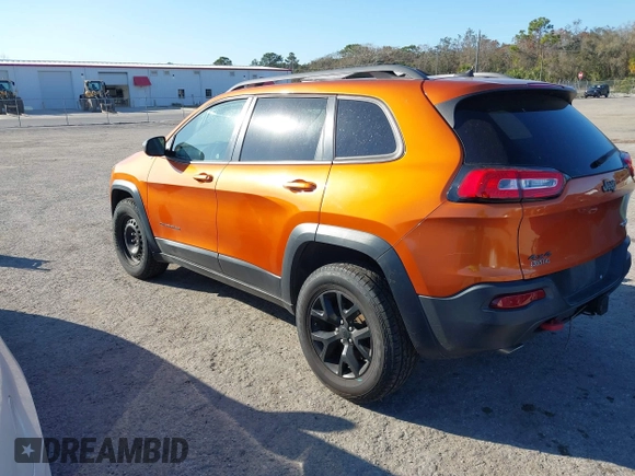 2014 Jeep Cherokee Trailhawk with VIN 1C4PJMBS4EW254879, listed as a IAAI auction lot 41550356 with 101,077 mi miles. Bid and sale history available at carsss.com. Image 3.