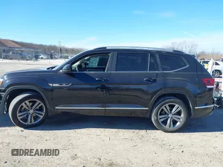 2019 Volkswagen Atlas SEL R-Line z VIN 1V2RR2CA6KC509913, wystawiony jako IAAI lot #41410198 z przebiegiem 97 681 mil mil oraz . Historia ofert i sprzedaży dostępna na DreamBid. Obrazek 14.