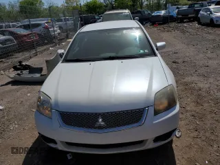 2010 Mitsubishi Galant FE z VIN 4A32B2FF1AE012718, wystawiony jako Copart lot #54487945 z przebiegiem 132 109 mil mil oraz Szkody całkowita. Historia ofert i sprzedaży dostępna na DreamBid. Obrazek 5.