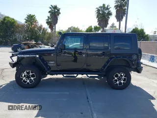 2008 Jeep Wrangler Unlimited Sahara with VIN 1J8GA59168L587554, listed as a IAAI auction lot 41963587 with 189,943 mi miles and . Bid and sale history available at DreamBid. Image 14.