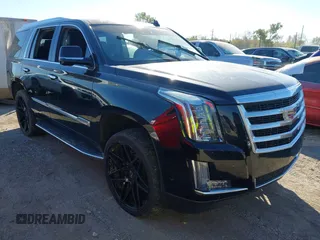 2015 Cadillac Escalade Luxury z VIN 1GYS4MKJ7FR661209, wystawiony jako IAAI lot #40645720 z przebiegiem Nie podano mil oraz . Historia ofert i sprzedaży dostępna na DreamBid. Obrazek 1.