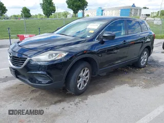2014 Mazda CX-9 Touring with VIN JM3TB2CA9E0442202, listed as a IAAI auction lot 42292356 with 239,578 mi miles and . Bid and sale history available at DreamBid. Image 2.
