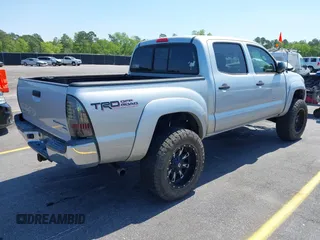 2013 Toyota Tacoma PreRunner z VIN 5TFJU4GN6DX032952, wystawiony jako IAAI lot #42001014 z przebiegiem 152 755 mil mil oraz . Historia ofert i sprzedaży dostępna na DreamBid. Obrazek 4.