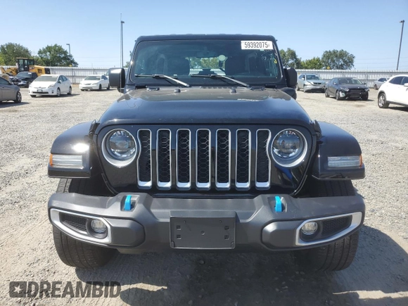 2023 Jeep Wrangler Sahara with VIN 1C4JJXP61PW512975, listed as a Copart auction lot 59392075 with 26,954 mi miles and Salvage title. Bid and sale history available at DreamBid. Image 5.