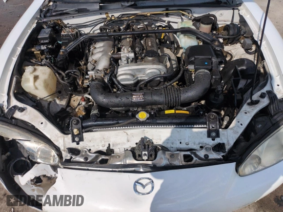 2002 Mazda MX-5 Miata Cloth z VIN JM1NB353X20229549, wystawiony jako Copart lot #54549205 z przebiegiem 79 871 mil mil oraz Szkoda całkowita • Salvage title. Historia ofert i sprzedaży dostępna na DreamBid. Obrazek 11.