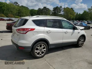 2016 Ford Escape Titanium with VIN 1FMCU9J94GUB31594, listed as a Copart auction lot 51690565 with 119,699 mi miles and Salvage Title. Bid and sale history available at DreamBid. Image 3.