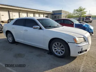 2012 Chrysler 300 Limited with VIN 2C3CCACGXCH216512, listed as a Copart auction lot 54104655 with 228,538 mi miles and Clean Title. Bid and sale history available at DreamBid. Image 4.