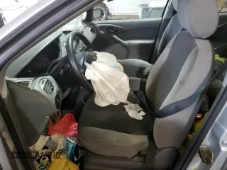 2003 Ford Focus SE z VIN 1FAFP34P43W186633, wystawiony jako Copart lot #56899065 z przebiegiem Nie podano mil oraz Szkoda całkowita • Salvage title. Historia ofert i sprzedaży dostępna na DreamBid. Obrazek 7.