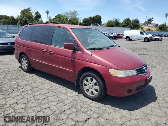 2004 Honda Odyssey EX-L with VIN 5FNRL18014B031578, listed as a Copart auction lot 56938795 with 241,085 mi miles and Salvage title. Bid and sale history available at DreamBid. Image 4.