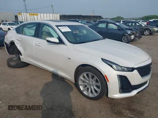 2021 Cadillac CT5 Luxury z VIN 1G6DX5RK7M0147407, wystawiony jako IAAI lot #42483593 z przebiegiem 19 202 mil mil oraz . Historia ofert i sprzedaży dostępna na DreamBid. Obrazek 1.