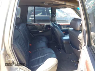 1998 Jeep Grand Cherokee Limited z VIN 1J4GZ88Z4WC328450, wystawiony jako IAAI lot #42652126 z przebiegiem 166 576 mil mil oraz . Historia ofert i sprzedaży dostępna na DreamBid. Obrazek 8.
