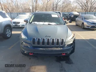2015 Jeep Cherokee Trailhawk with VIN 1C4PJMBS3FW510219, listed as a IAAI auction lot 41440297 with 144,012 mi miles and . Bid and sale history available at DreamBid. Image 10.