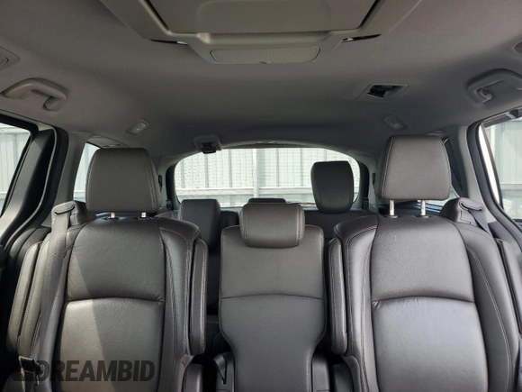 2019 Honda Odyssey Touring z VIN 5FNRL6H80KB501681, wystawiony jako Copart lot #58814945 z przebiegiem 105 287 mil mil oraz Szkoda całkowita • Salvage title. Historia ofert i sprzedaży dostępna na DreamBid. Obrazek 10.