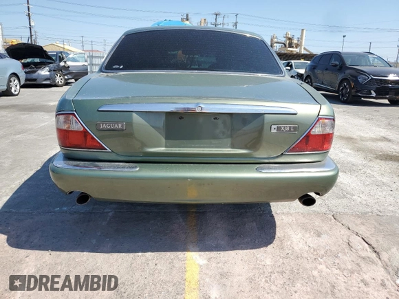 1999 Jaguar XJ with VIN SAJHX604XXC854217, listed as a Copart auction lot 56042735 with 127,092 mi miles and Salvage title. Bid and sale history available at DreamBid. Image 6.