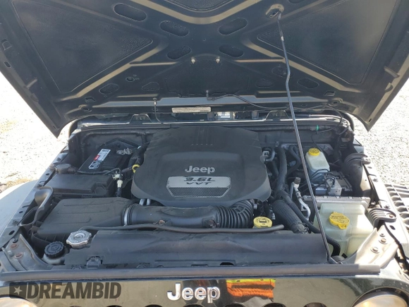 2012 Jeep Wrangler Sport z VIN 1C4AJWAG9CL257841, wystawiony jako Copart lot #57731255 z przebiegiem 112 614 mil mil oraz Szkoda całkowita • Salvage title. Historia ofert i sprzedaży dostępna na DreamBid. Obrazek 11.