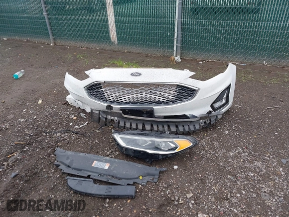 2020 Ford Fusion Titanium with VIN 3FA6P0RUXLR139574, listed as a IAAI auction lot 42299070 with 92,751 mi miles and . Bid and sale history available at DreamBid. Image 12.