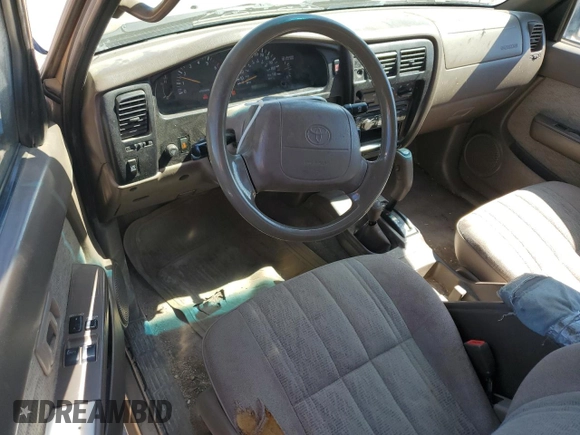 1999 Toyota Tacoma with VIN 4TAWN72N4XZ560411, listed as a Copart auction lot 61499925 with 395,215 mi miles and Salvage title. Bid and sale history available at DreamBid. Image 8.