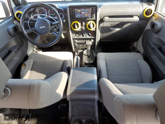 2009 Jeep Wrangler Rubicon with VIN 1J4GA64149L757121, listed as a Copart auction lot 74258934 with 73,241 mi miles and Salvage Title. Bid and sale history available at DreamBid. Image 8.
