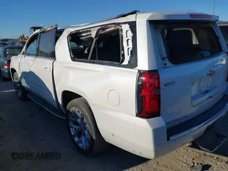 2019 Chevrolet Suburban Premier with VIN 1GNSCJKC0KR293658, listed as a IAAI auction lot 40563834 with 153,619 mi miles. Bid and sale history available at carsss.com. Image 3.