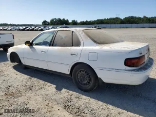 1996 Toyota Camry DX with VIN JT2BG12K7T0351784, listed as a Copart auction lot 52815345 with 303,537 mi miles and Clean Title. Bid and sale history available at carsss.com. Image 2.
