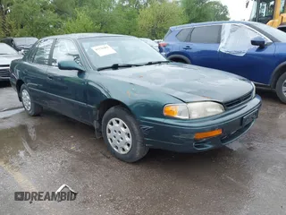 1996 Toyota Camry DX with VIN JT2BG12K5T0346311, listed as a IAAI auction lot 42130482 with 214,872 mi miles. Bid and sale history available at carsss.com. Image 1.