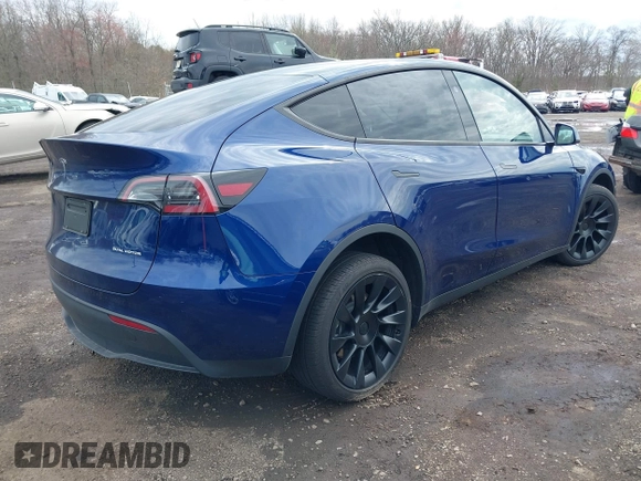 2023 Tesla Model Y Long Range with VIN 7SAYGDEE4PF891709, listed as a IAAI auction lot 41944893 with 15,864 mi miles. Bid and sale history available at carsss.com. Image 4.