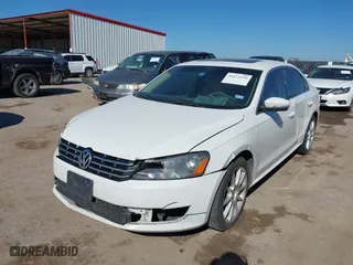 2014 Volkswagen Passat TDI SE w/Sunroof with VIN 1VWBN7A32EC016554, listed as a IAAI auction lot 41472156 with 178,149 mi miles. Bid and sale history available at carsss.com. Image 2.