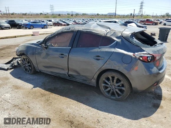 2016 Mazda 3 S Touring with VIN JM1BM1M3XG1342809, listed as a Copart auction lot 61915845 with 141,227 mi miles and Salvage title. Bid and sale history available at DreamBid. Image 2.