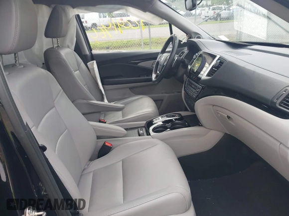 2017 Honda Pilot Touring with VIN 5FNYF6H90HB052474, listed as a IAAI auction lot 42291464 with 103,288 mi miles and . Bid and sale history available at DreamBid. Image 5.