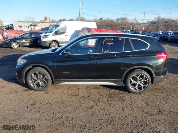 2017 BMW X1 xDrive28i with VIN WBXHT3Z33H4A65699, listed as a IAAI auction lot 41752257 with 66,306 mi miles. Bid and sale history available at carsss.com. Image 14.