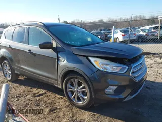 2018 Ford Escape SE with VIN 1FMCU0GD0JUA87303, listed as a IAAI auction lot 41612502 with 70,233 mi miles. Bid and sale history available at carsss.com. Image 1.