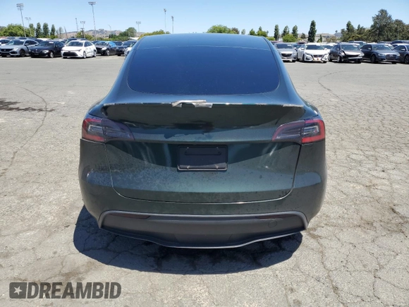 2022 Tesla Model Y Performance z VIN 7SAYGDEF2NF573979, wystawiony jako Copart lot #57778265 z przebiegiem 49 232 mil mil oraz Szkoda całkowita • Salvage title. Historia ofert i sprzedaży dostępna na DreamBid. Obrazek 6.