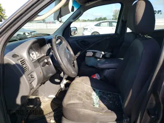 2004 Ford Escape XLS with VIN 1FMYU92134KA21707, listed as a Copart auction lot 72114804 with 219,518 mi miles and Salvage Title. Bid and sale history available at DreamBid. Image 7.