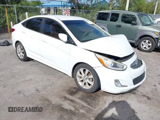 2014 Hyundai Accent GLS with VIN KMHCU4AE8EU608539, listed as a IAAI auction lot 41946784 with 106,709 mi miles. Bid and sale history available at carsss.com. Image 1.