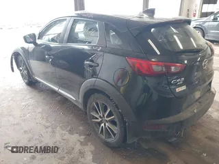 2016 Mazda CX-3 Grand Touring with VIN JM1DKFD71G0132801, listed as a IAAI auction lot 41573276 with 90,000 mi miles. Bid and sale history available at carsss.com. Image 3.