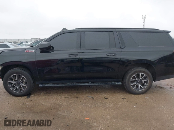 2022 Chevrolet Suburban Z71 with VIN 1GNSKDKD3NR251387, listed as a IAAI auction lot 41566234 with 154,014 mi miles. Bid and sale history available at carsss.com. Image 14.