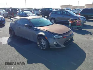 2013 Scion FR-S with VIN JF1ZNAA13D2704909, listed as a IAAI auction lot 41490557 with 88,028 mi miles. Bid and sale history available at carsss.com. Image 1.