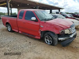 1999 Ford F-150 with VIN 1FTZX1725XNA33332, listed as a Copart auction lot 51867455 with 163,023 mi miles and Salvage title. Bid and sale history available at DreamBid. Image 4.