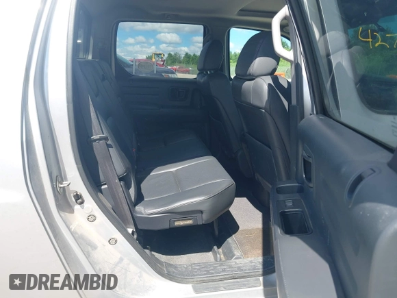 2013 Honda Ridgeline RTL with VIN 5FPYK1F51DB007236, listed as a IAAI auction lot 42762126 with 201,758 mi miles and . Bid and sale history available at DreamBid. Image 8.