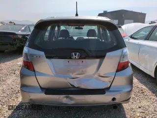 2010 Honda Fit Sport with VIN JHMGE8H41AC002070, listed as a Copart auction lot 62356565 with 148,279 mi miles and Salvage title. Bid and sale history available at DreamBid. Image 6.