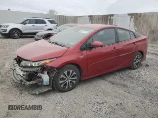 2022 Toyota Prius LE z VIN JTDKAMFP5N3213162, wystawiony jako Copart lot #82551774 z przebiegiem 55 173 mil mil oraz Szkoda całkowita • Salvage title. Historia ofert i sprzedaży dostępna na DreamBid. Obrazek 1.