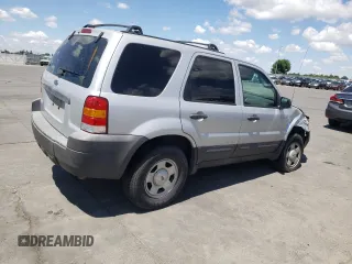 2007 Ford Escape XLS z VIN 1FMYU02Z97KC06172, wystawiony jako Copart lot #56978575 z przebiegiem 155 456 mil mil oraz Szkoda całkowita • Salvage title. Historia ofert i sprzedaży dostępna na DreamBid. Obrazek 3.